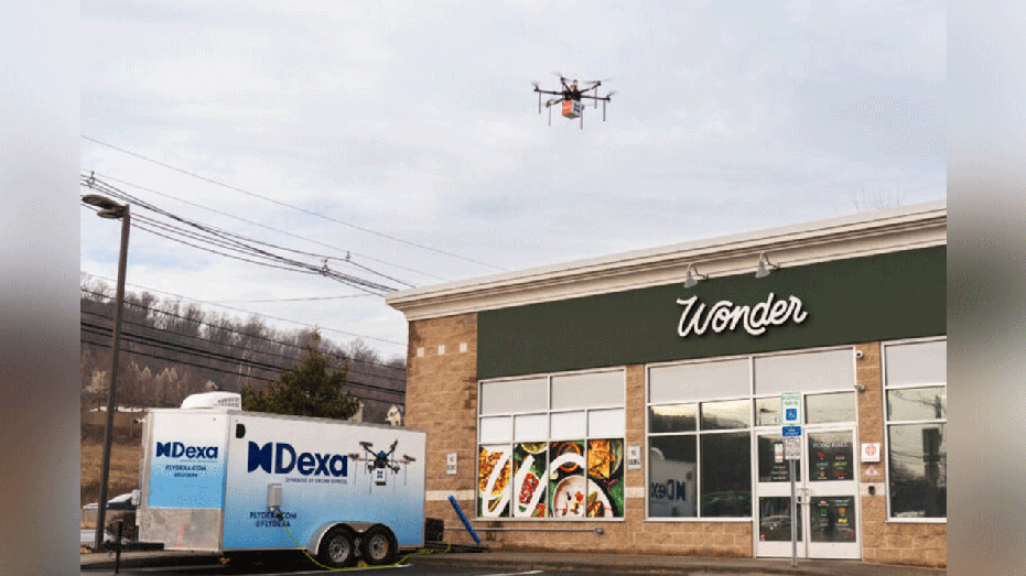 a drone next to a wonder store and dexa vehicle