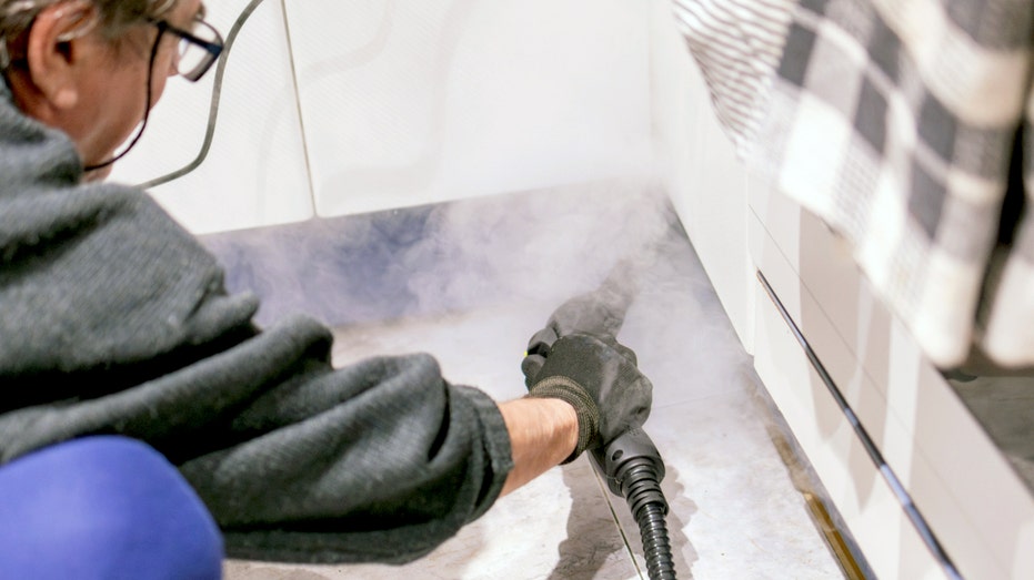 Person using a steamer.