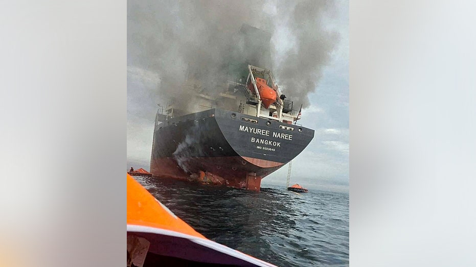 The rear of the Mayuree Naree cargo ship with black smoke