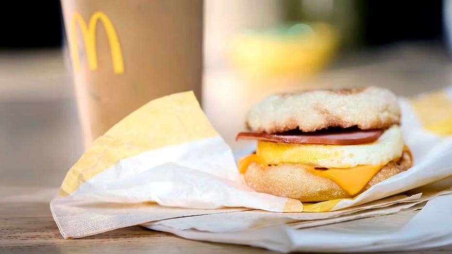 A McMuffin sandwich on a table.