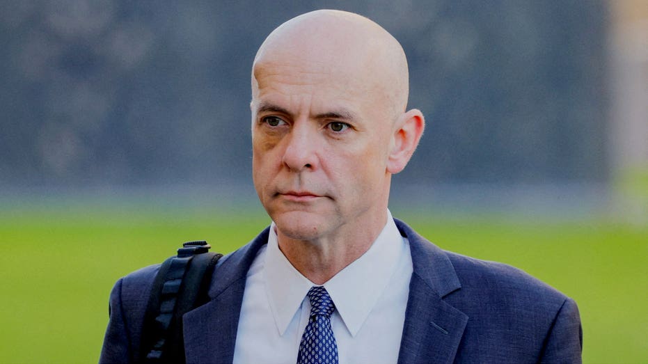 Attorney Paul Schmidt walks outside a courtroom in California.