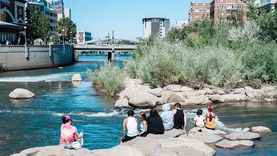 People enjoying the Truckee River in Downtown Reno