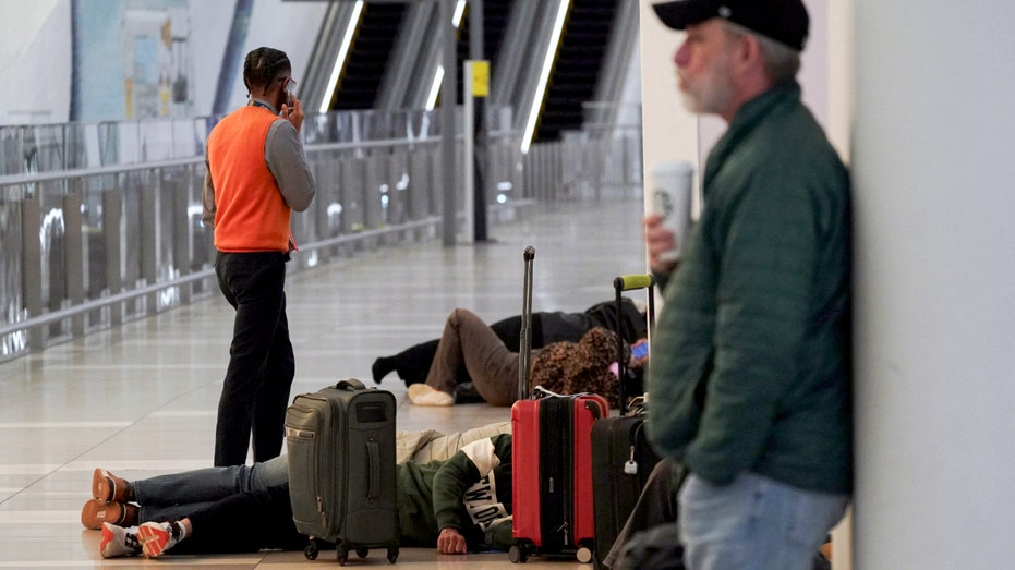 Travelers stuck at LaGuardia Airport.