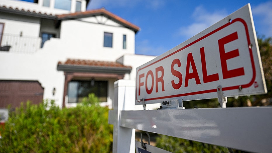 Home with for sale sign