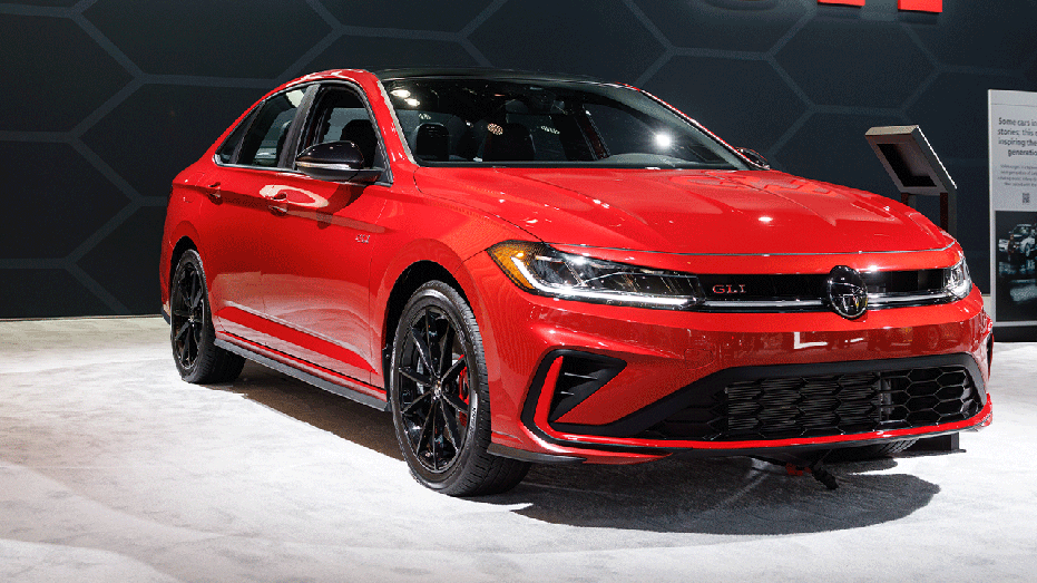 Red Voltswagen Jetta on display inside building