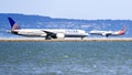 United Airlines aircraft preparing to take off and American Airlines aircraft landing at San Francisco International Airport on Sept. 1, 2019. - Fox News