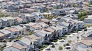 SANTA CLARITA, CALIFORNIA - APRIL 07: An aerial view shows homes in a housing development on April 7, 2026 in Santa Clarita, California. Before the war in Iran began, the average 30-year fixed home mortgage rate had fallen below 6 percent, but rates have since climbed back up to close to 6.5 percent. - Fox Business News