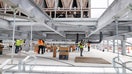 GARLAND, TEXAS - MARCH 4: Construction workers build out the rooftop chillers and water lines feeding them atop Dallas TX4, which is under construction at the NTT Data center campus in Garland, Texas, March 4, 2026. It will take 40 of those water-filled chillers to cool the fourth data center built on the property.  - Fox Business News