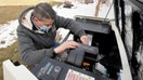 A worker from Captain Electric makes final inspections on a newly installed 24-kilowatt Generac home generator on February 18, 2021 in Orem, Utah. - Fox Business News