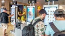 Customers using touchscreen kiosk ordering system inside McDonald's, Washington Avenue, Miami Beach, Florida. - Fox Business News