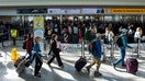 Passengers wait in a TSA security checkpoint queue that stretches through Baltimore/Washington International Thurgood Marshall Airport (BWI) in Baltimore, Maryland., U.S., March 29, 2026.  - Fox Business News