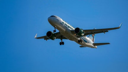 A Frontier Airlines plane approaches Ronald Reagan Washington National Airport near Alexandria, Virginia, on Dec. 24, 2025. - Fox Business News
