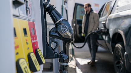 A man is seen pumping gas into his truck at a fuel station. - Fox Business News