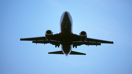 generic Boeing 737-500 on final-approach landing with flaps deployed at dusk. (Photo by: aviation-images.com/Universal Images Group via Getty Images) - Fox Business News