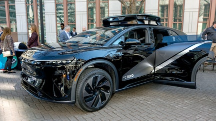 A Lucid Gravity autonomous taxi at the first National AV Safety Forum held by the National Highway Traffic Safety Administration (NHTSA) at the Department of Transportation (DOT) headquarters in Washington, D.C., on March 10, 2026. - Fox Business News