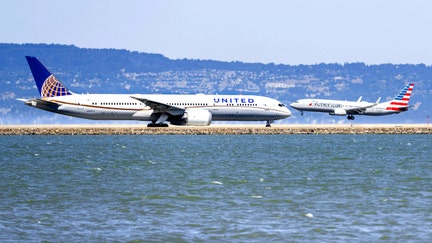 United Airlines aircraft preparing to take off and American Airlines aircraft landing at San Francisco International Airport on Sept. 1, 2019. - Fox Business News