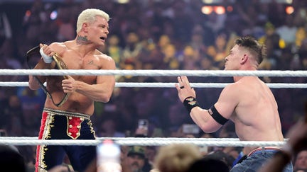 ody Rhodes (L) debates hitting John Cena with the championship belt during their Undisputed WWE Championship match during WrestleMania 41 at Allegiant Stadium on April 20, 2025 in Las Vegas, Nevada.  - Fox Business News