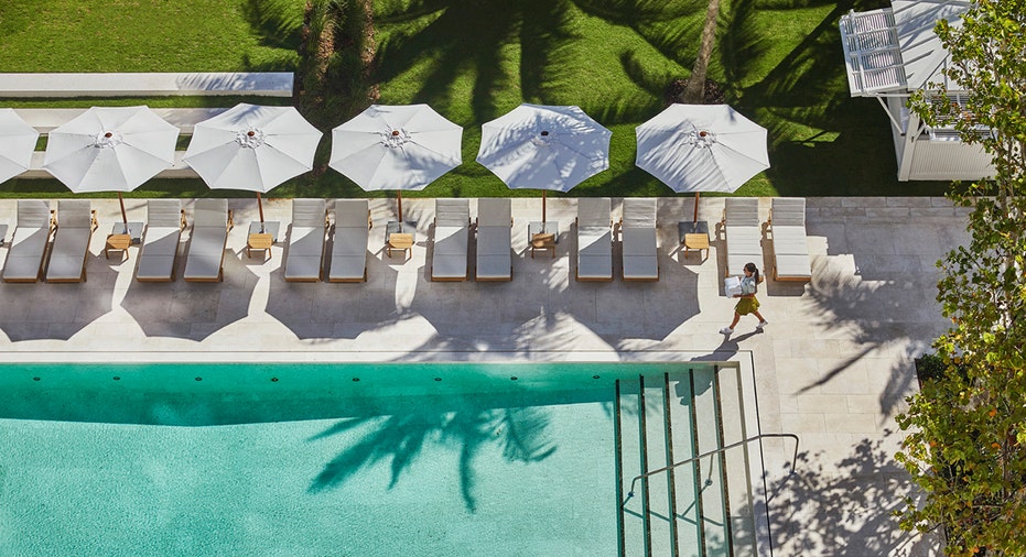 Resort pool with white umbrellas