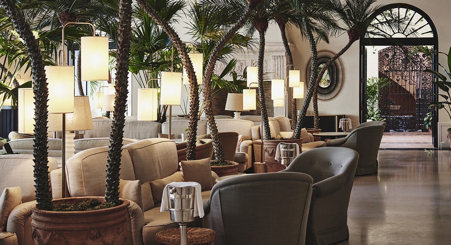 Luxury hotel lobby with palm trees