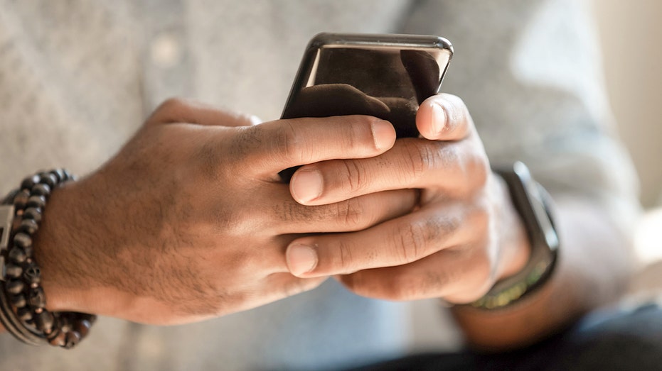 Hands holding a phone