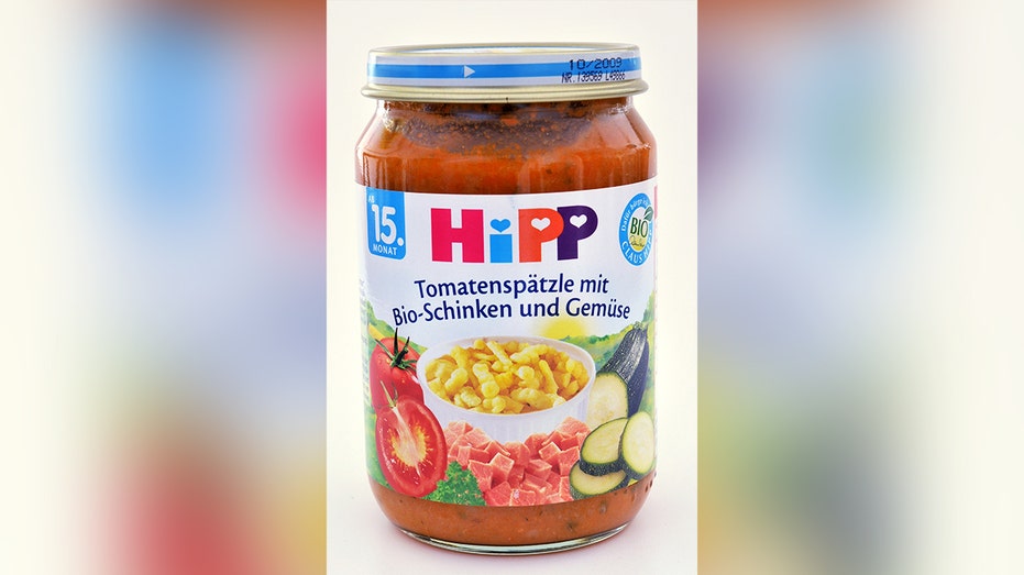 a hipp baby food jar containing tomato-based puree