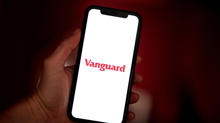 The Vanguard Group logo on phone