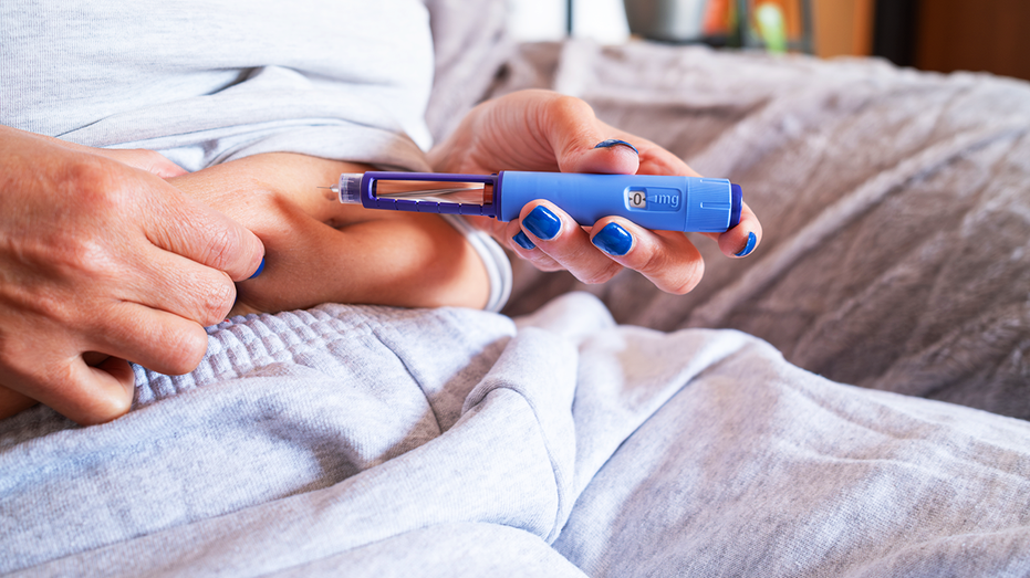 Woman injecting medicine