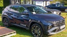 Hyundai Tuscon Plug-in hybrid crossover SUV on display. Hyundai has recalled more than 421,000 vehicles over a software bug that could cause the vehicles to brake prematurely.  - Fox Business News