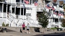 BOSTON, MA - SEPTEMBER 23: People walk down Eaton Street, where there is mostly student housing in Providence, RI on Sept. 23, 2020. 165 students from Providence College tested positive for COVID-19 over the past week, neighbors worry that middle-class Elmhurst has, virtually overnight, become the new epicenter of the highly contagious virus in Rhode Island. While the campus itself is tiny, the neighborhood has become an extension of the school. - Fox Business News
