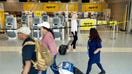 Passengers roll past the empty Spirit Airlines ticket counter in Terminal E at DFW Airport is empty, May 5, 2026, after the company shuttered its operations. - Fox Business News