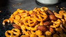 A close-up of a trail mix containing pretzels, almonds and crunchy snack pieces is shown in this undated photo. - Fox Business News