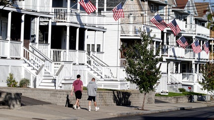BOSTON, MA - SEPTEMBER 23: People walk down Eaton Street, where there is mostly student housing in Providence, RI on Sept. 23, 2020. 165 students from Providence College tested positive for COVID-19 over the past week, neighbors worry that middle-class Elmhurst has, virtually overnight, become the new epicenter of the highly contagious virus in Rhode Island. While the campus itself is tiny, the neighborhood has become an extension of the school. - Fox Business News