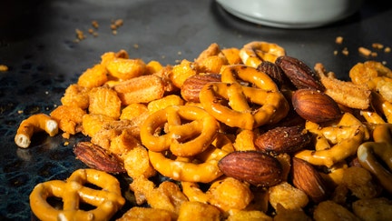 A close-up of a trail mix containing pretzels, almonds and crunchy snack pieces is shown in this undated photo. - Fox Business News