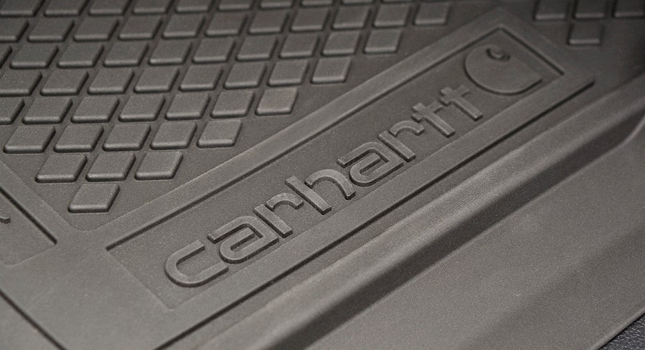 A close-up of a Carhartt-branded floor mat inside the Ford Super Duty Carhartt edition truck