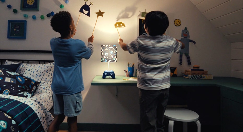 Children play in a bedroom decorated with products from Walmart’s new Mainstays Kids collection.