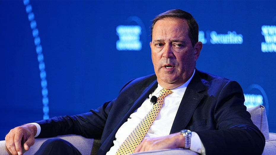 Chuck Robbins speaks during a conference