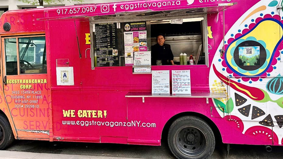 A bright pink food truck