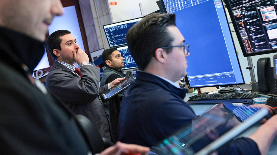 Brokers on New York Stock Exchange floor