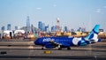 An Airbus A320 plane, operated by JetBlue Airlines at Newark Liberty International Airport (EWK) in front of the skyline of lower Manhattan and One World Trade Center in New York City on Jan. 15, 2026 in Newark, New Jersey. - Fox News