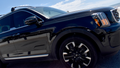 A black Kia Telluride luxury SUV cruising amongst competitors on Seawell Blvd. at Galveston Beach during a gorgeous day as summer season approaches at the horizon. - Fox News