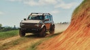 The 2027 Ford Bronco Filson drives along a dirt trail. - Fox Business News