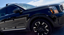 A black Kia Telluride luxury SUV cruising amongst competitors on Seawell Blvd. at Galveston Beach during a gorgeous day as summer season approaches at the horizon. - Fox Business News