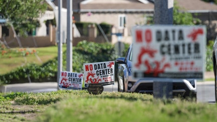 Signs of protest against data centers pepper front yards in a residential neighborhood in Monterey Park, California, on April 1, 2026. - Fox Business News
