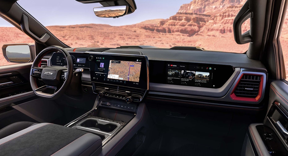 The front passenger-side interior of a 2027 Chevrolet Silverado 1500 ZR2 features Dark Galvanized trim.