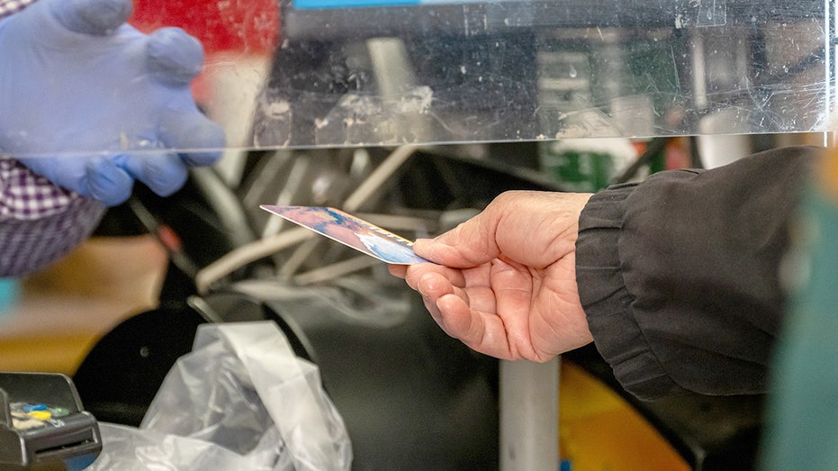 A person checks out using a credit card