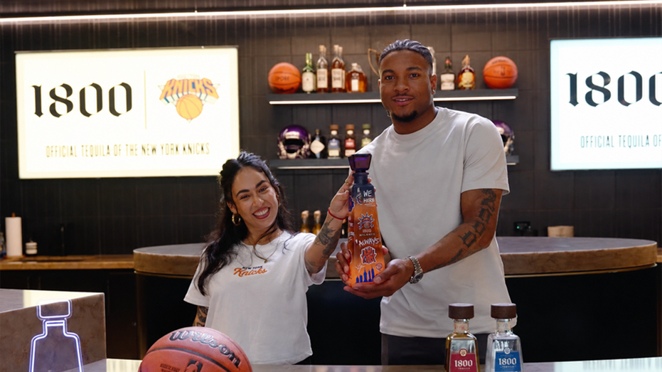 Miles McBride and Fefi show off 1800 Tequila bottle