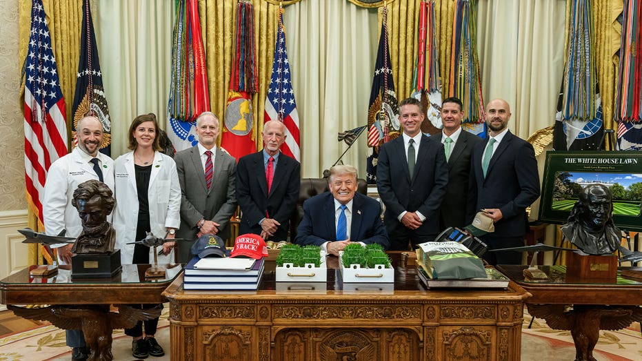 President Trump surrounded by the Scotts Miracle-Gro team in the Oval Office.