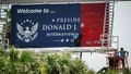 Workers install the new road entrance signage at Palm Beach International Airport in unincorporated Palm Beach County, Fla., on July 8, 2026. - Fox News