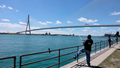 People fish in the Detroit River in front of the Gordie Howe International Bridge in Detroit, Michigan, on June 12, 2026. - Fox News