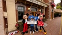 Eight-year-old Andres Robles of Arizona celebrates after being named Disneyland's honorary one billionth guest during a surprise ceremony at the California theme park.